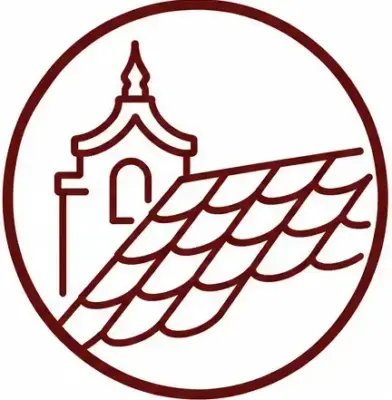 Circular logo depicting a stylized church facade with a tiled roof in maroon.